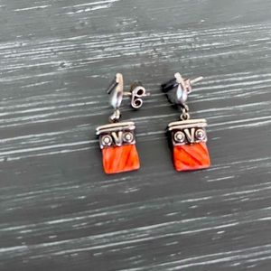 Hand made sterling silver (925 gr) with coral stone.